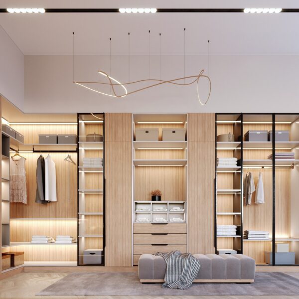 Elegant modern walk-in closet featuring light wood finishes, ambient LED lighting, and organized open shelving for a luxurious and functional wardrobe space.