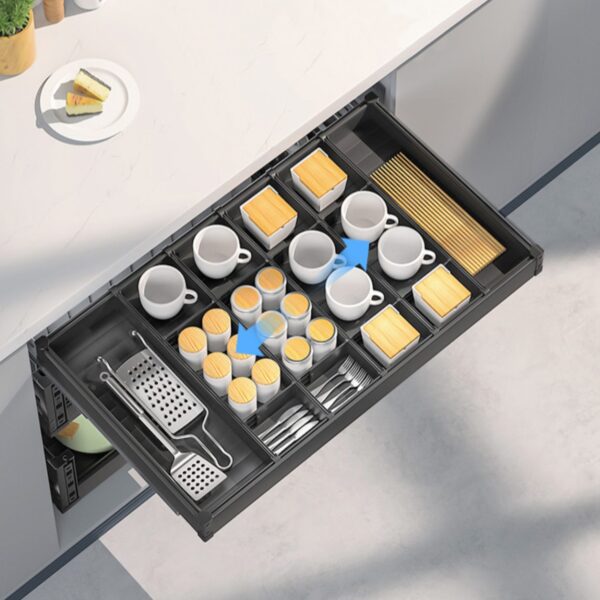 Modern pull-out drawer organizer with neatly arranged cups, utensils, and dry food storage compartments.