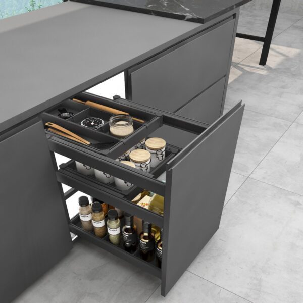 Modern kitchen with a sleek pull-out storage drawer featuring organized spice jars, utensils, and bottles.