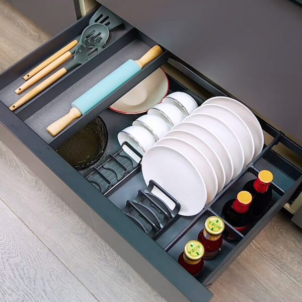 Modern kitchen drawer organizer with dedicated sections for plates, utensils, rolling pins, and condiments.