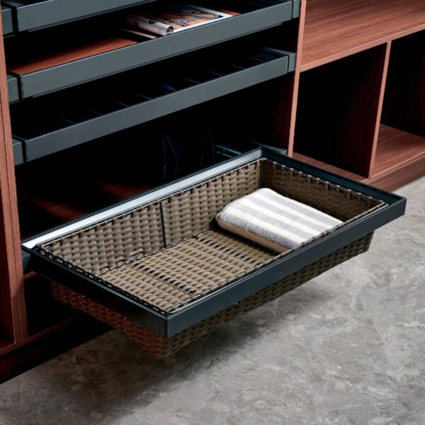 Pull-out wicker storage drawer in a modern wardrobe, ideal for organizing clothes and accessories.