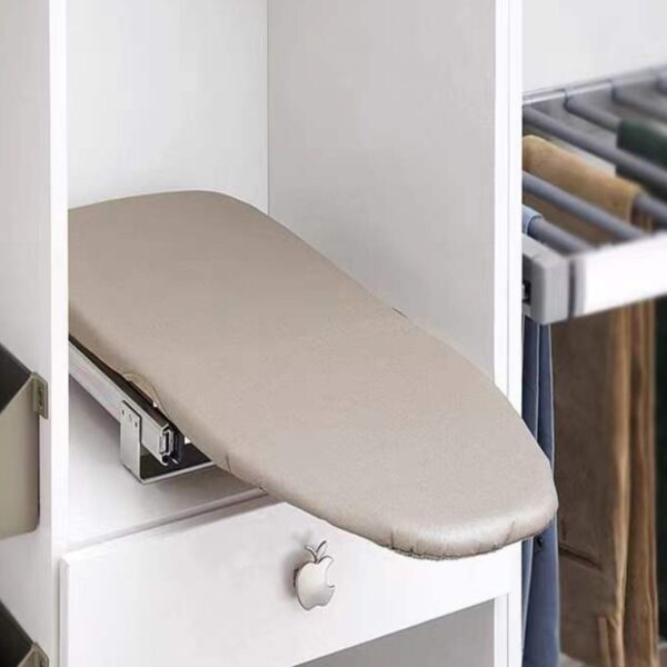 Pull-out folding ironing board integrated into a white wardrobe cabinet for space-saving convenience.