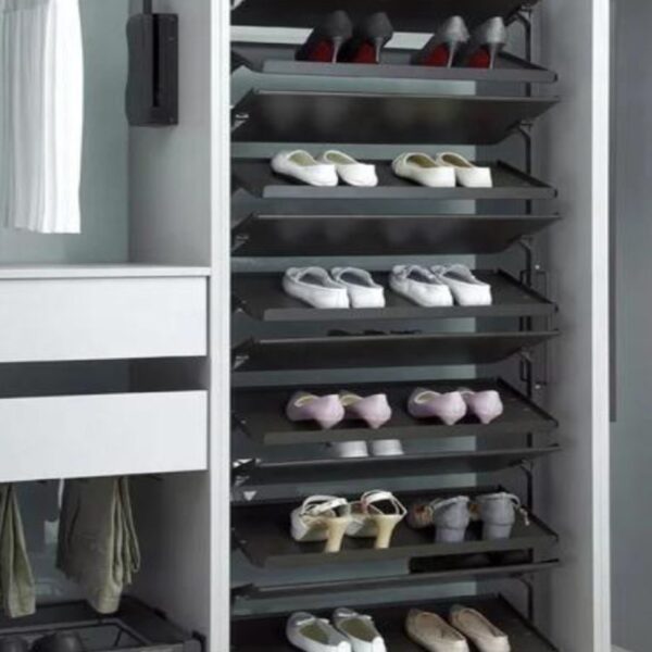 Pull-out shoe rack in a modern wardrobe, neatly organizing multiple pairs of shoes for easy access.